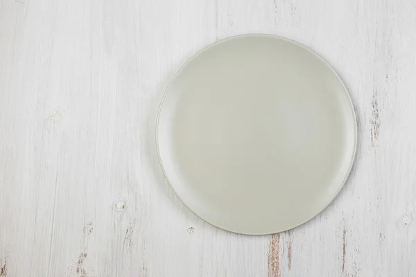 Empty clean plate  on white table