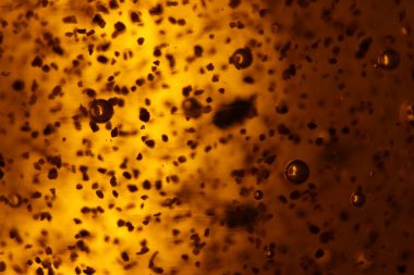 Soyut altın arka plan kabarcıkları nadir şekillerde farklıdır