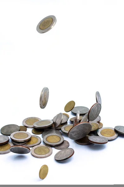 Coins falling to the ground — Stock Photo, Image