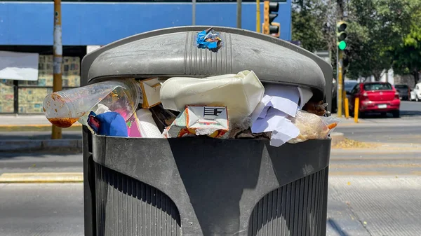 close up Public Trash can full of garbage