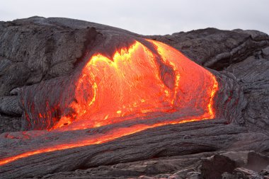 Red hot lava flowing in Hawaii clipart