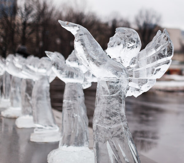Carved sculpture of frozen angel in ice