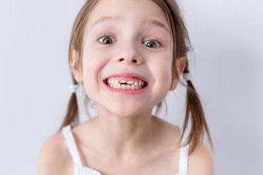 Close up portrait of preschooler girl with open mouth clipart