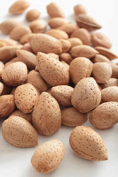 Almonds on white table — Stock Photo, Image