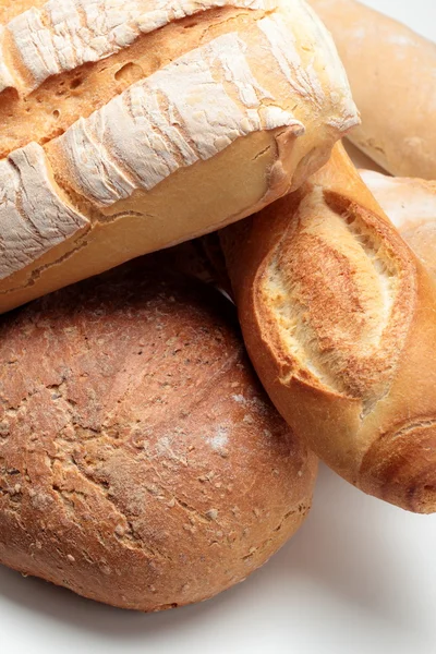 BAKED BREAD BAKED ON THE WHITE BACKGROUND — Stock Photo, Image