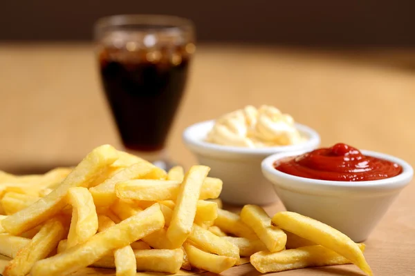 French Fries on wooden table — Stock Photo, Image