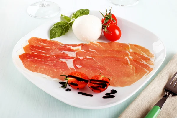 Italian ham and mozzarella with tomatoes — Stock Photo, Image