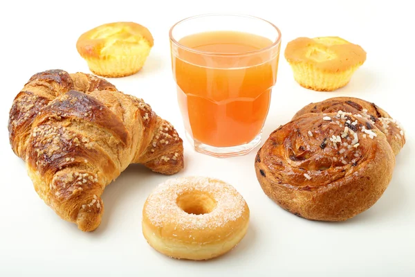 Croissant donuts and orange juice on white background — Stock Photo, Image