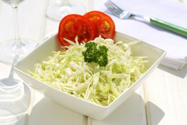 Cabbage salad on ceramic bowl clipart