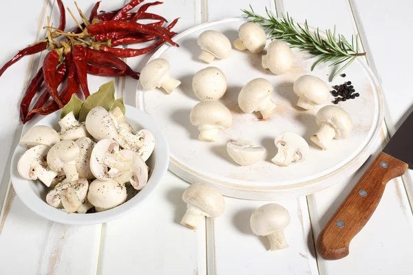 Mushroom on white cutting board — Stock Photo, Image