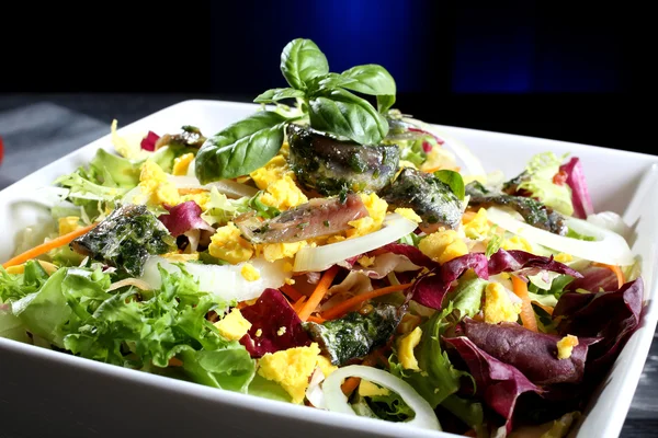 Salad with anchovies lettuce and onion — Stock Photo, Image