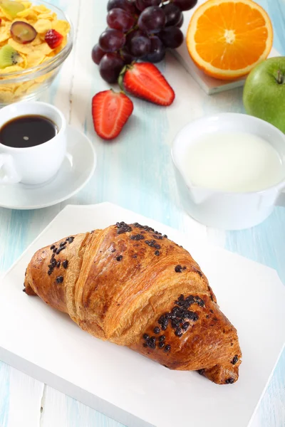 Croissant on breakfast table — Stock Photo, Image