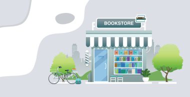 Arka planda şehir olan bisikletli bir kitapçı..