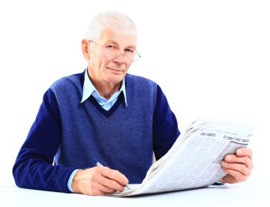 Portrait of an old man solving crosswords in the newspaper clipart