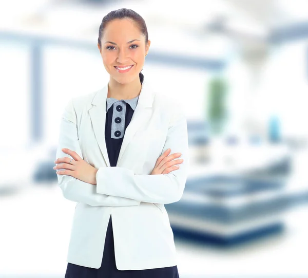 A portrait of a young business woman in an office — Stock Photo, Image