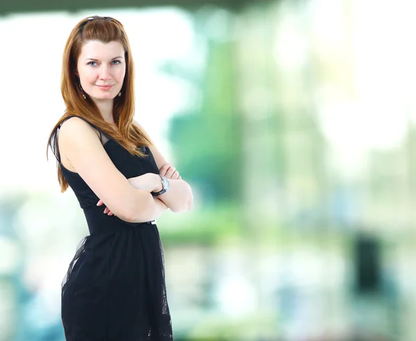 A portrait of a young business woman in an office — Stock Photo, Image