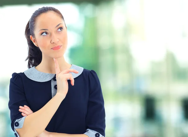 A portrait of a young business woman in an office — Stock Photo, Image