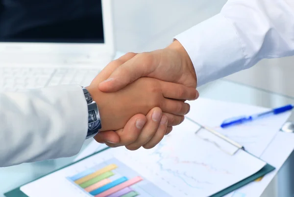 Closeup of a business hand shake between two colleagues — Stock Photo, Image