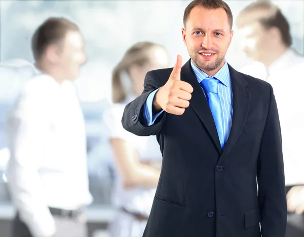 Businessman showing OK sign with his thumb up — Stock Photo, Image