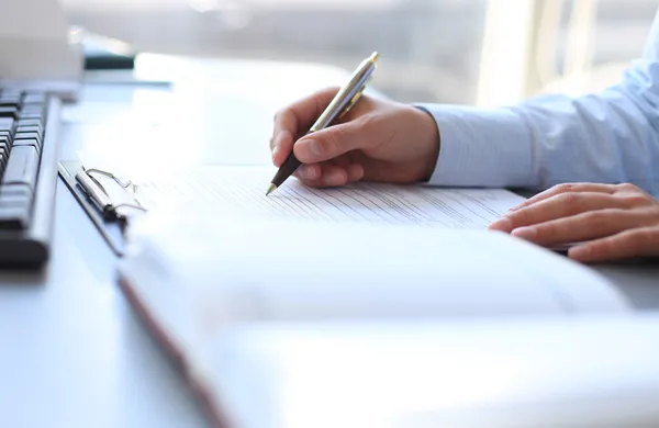 Businesswoman hands pointing at business document — Stock Photo, Image