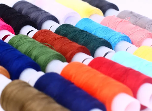 stock image Sewing threads multicolored background closeup