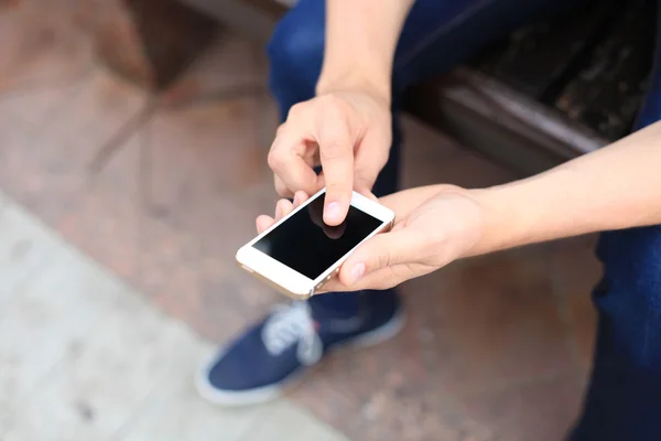 Close up of a man using mobile smarphone — стоковое фото