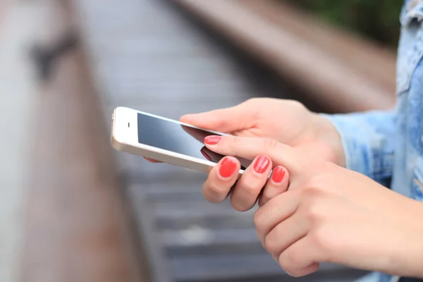 Close up of a woman using mobile smart phone — Stock Photo, Image