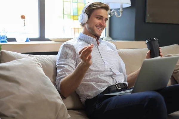 Concentrated Young Freelancer Businessman Sitting Sofa Laptop Working Remotely Online — Stock Photo, Image