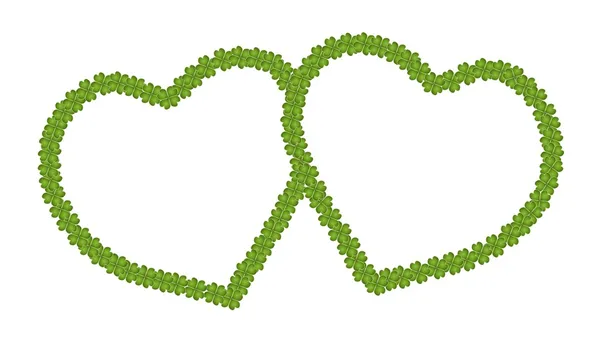 Um quadro vazio de forma de coração de trevo de quatro folhas — Fotografia de Stock