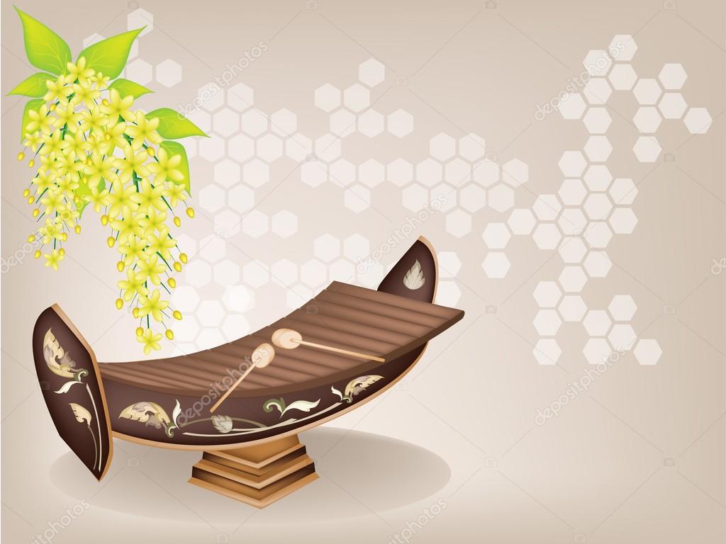 Thai Xylophone and Cassia Fistula Flower on Brown Background