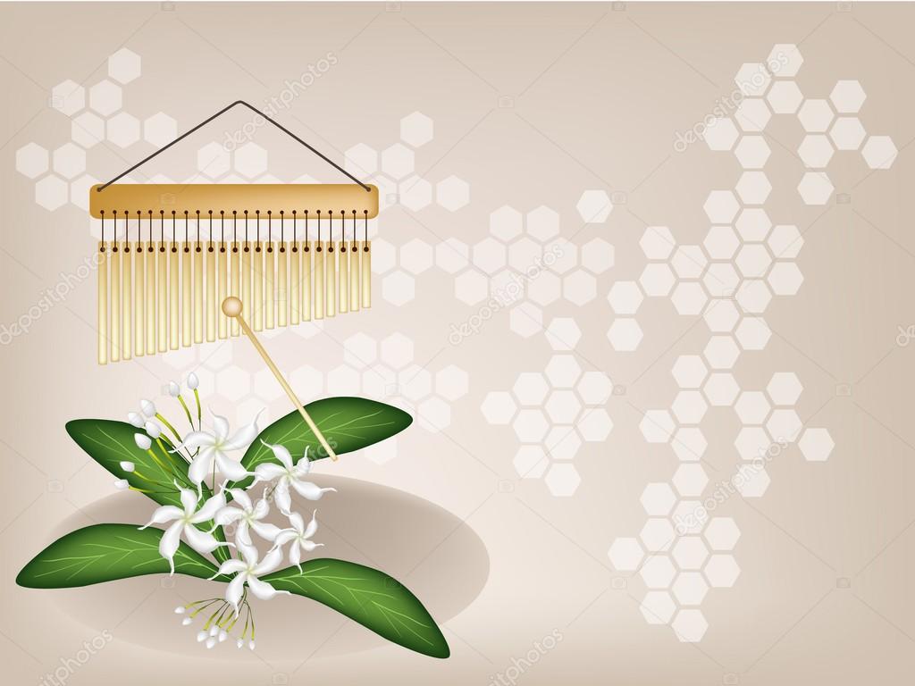 A Musical Bar Chimes and Jasmine on Brown Background
