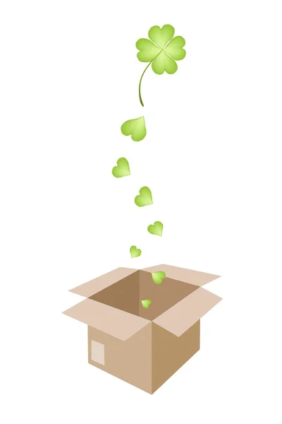 Hermosos tréboles de cuatro hojas en una caja de envío — Vector de stock