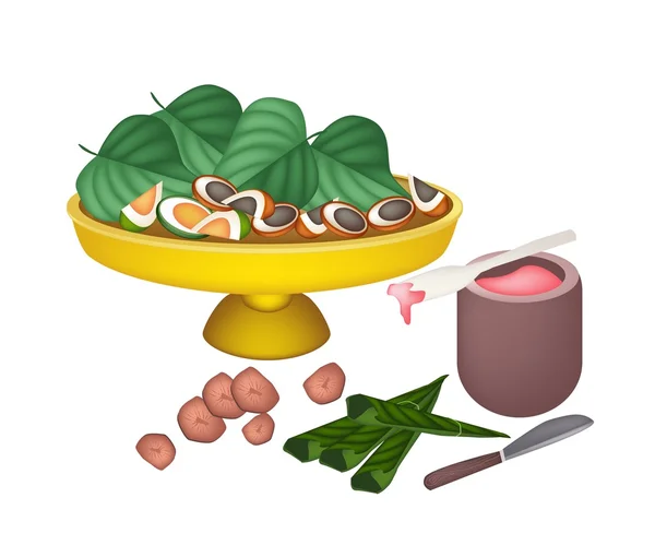 Nueces maduras de Areca y hojas de betel en una bandeja — Vector de stock