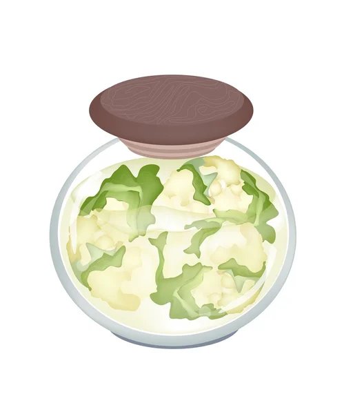 Un tarro de deliciosa coliflor blanca en escabeche — Vector de stock
