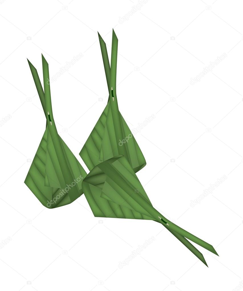 Thai Dessert Wrap with Banana Leaves on White Background