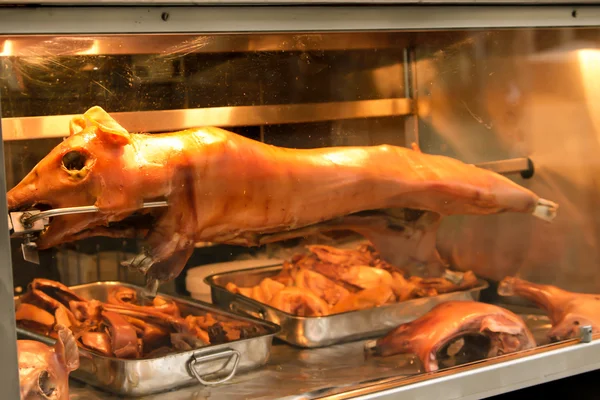 Roast pig on a spit Stock Picture