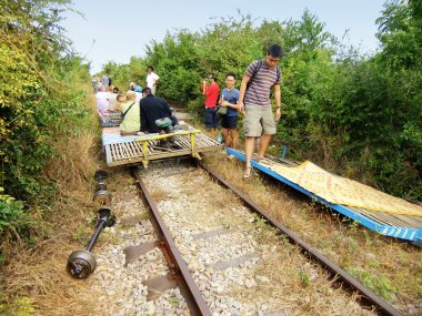 Tourists riding bamboo train, Battambang, Cambodia clipart