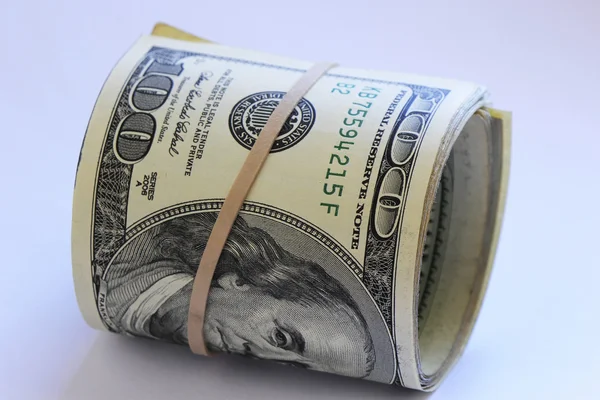 Roll of hundred dollar bills — Stock Photo, Image