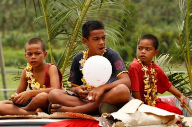 Tongan boys celebrate arriving Fuifui Moimoi on Vavau island, To clipart