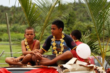 Tongan boys celebrate arriving Fuifui Moimoi on Vavau island, To clipart