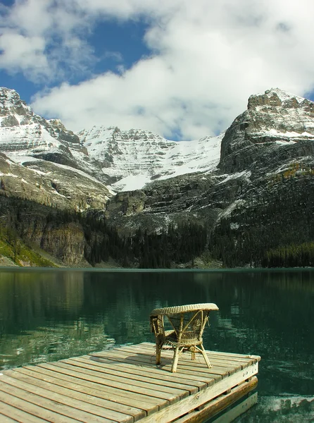 Chair on a wooden pier, Lake O'Hara, Yoho National Park, Canada — Stock Photo, Image
