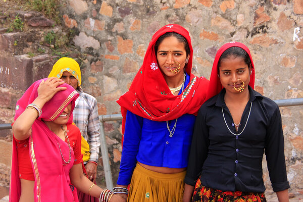 Indian women in colorful saris walking up the stairs at Ranthamb