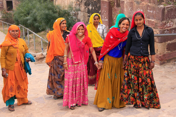 Indian women in colorful saris walking up the stairs at Ranthamb