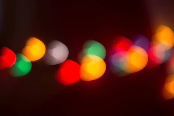 Close Luzes Natal Borrão Luzes Multicoloridas Fundo Escuro — Fotografia de Stock