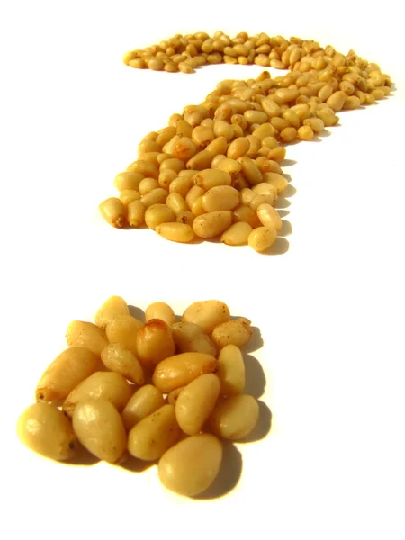 Pine nuts in the form of a question mark — Stock Photo, Image
