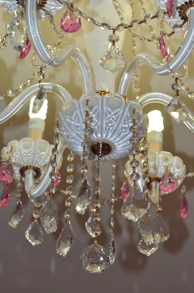 Chic crystal chandelier in white and pink colors — Stock Photo, Image