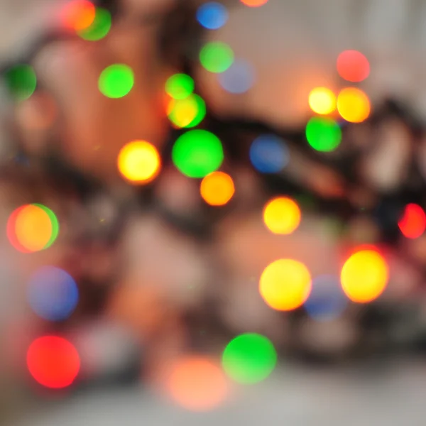 Fondo de vacaciones abstracto, luces de Navidad en colores brillantes — Foto de Stock
