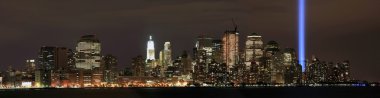 Ground zero memorial lights viewed from NJ clipart