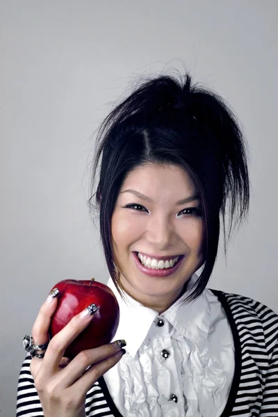 Asian woman with apple — Stock Photo, Image