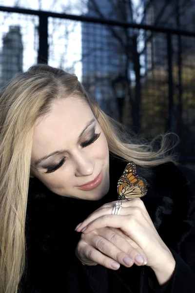 Girl with butterfly — Stock Photo, Image